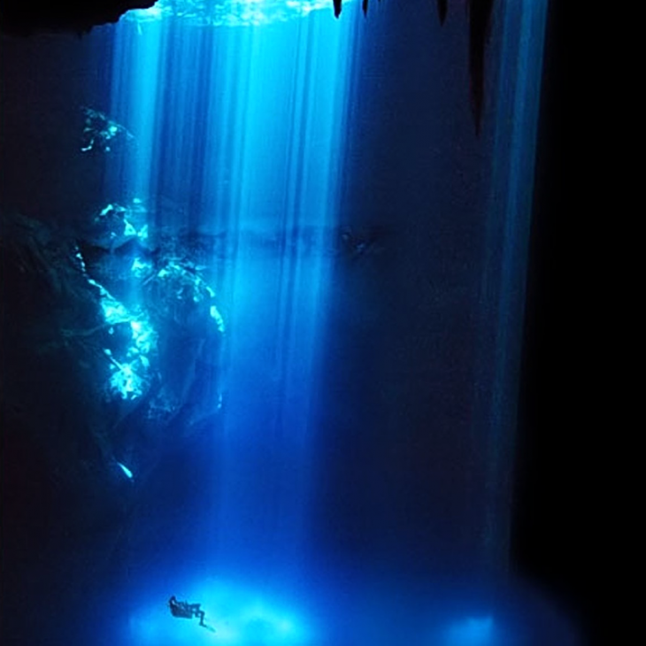 Light shines on diver at Cenote the Pit