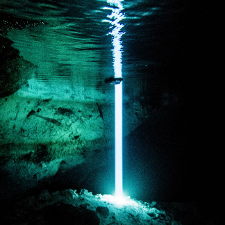 Light Beam enters the ceiling in the Points of Light room in the Taj Ma Ha Cenote