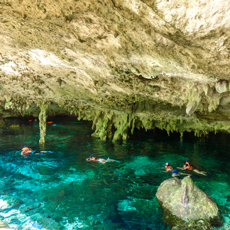 The entrance to Cenote Dos Ojos near Tulum is used by snorkelers beginning their experience.